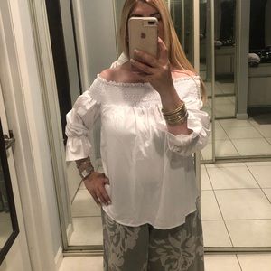 White off shoulder blouse with bow on back